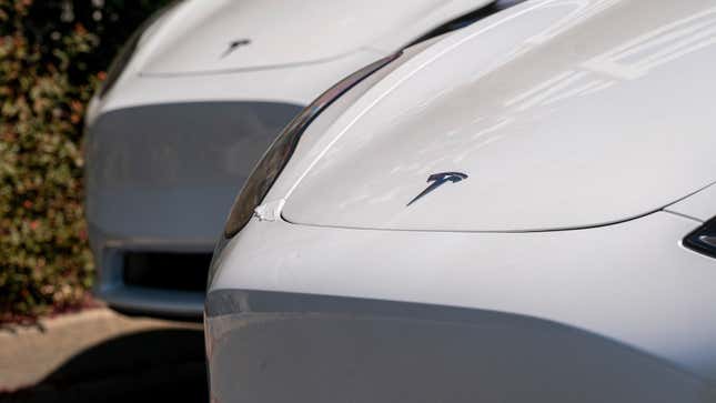 A photo of the front end of a Tesla Model 3 electric car. 