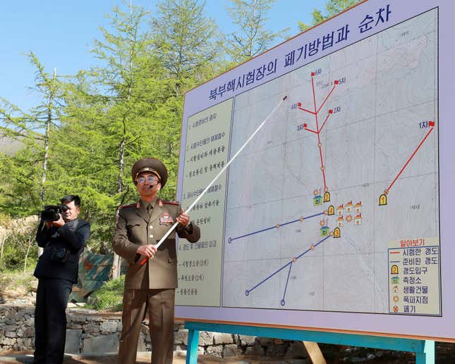 A North Korean official speaks to the media about the dismantling process prior to the detonation of explosives during the first day of dismantling at North Korea's Punggye-ri nuclear test site in Punggye-ri, North Korea, 24 May 2018 (issued 25 May 2018). On 24 May North Korea started to demolish its Punggye-ri nuclear test facility, in the country's northeast. South Korean journalists covering the process said the demolition of the site was carried out in a series of explosions over several hours on the day.