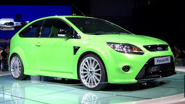 A green Ford Focus RS on an autoshow floor