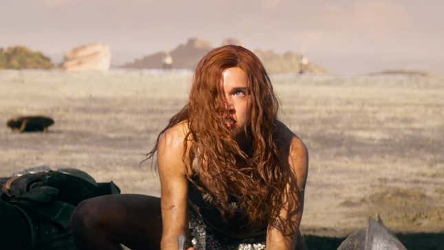 Sonja looks up after plunging a dagger into an enemy.