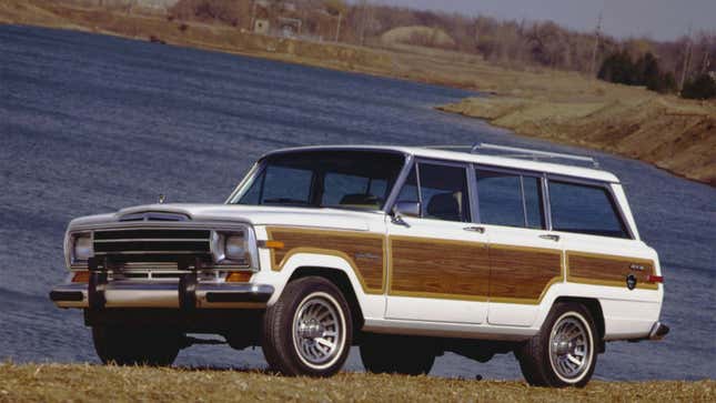 A photo of a white 1989 Grand Wagoneer with wood panelling. 