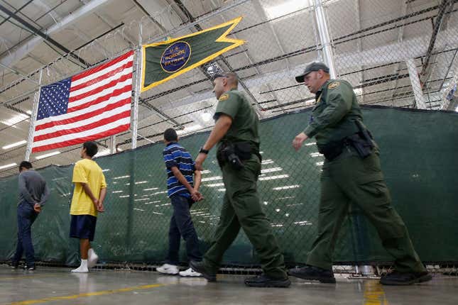 Young detainees escorted to an area to make phone calls.