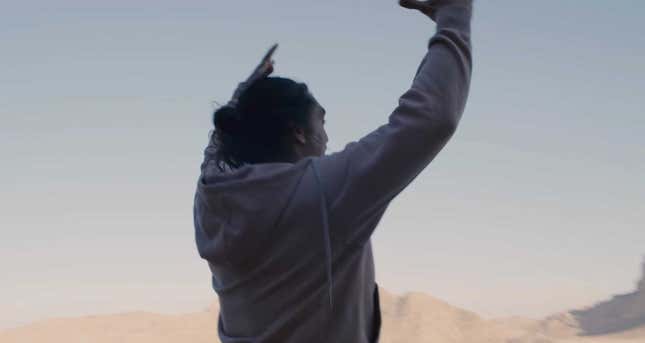 Actor Jason Momoa shouting to the sky while filming Dune. 