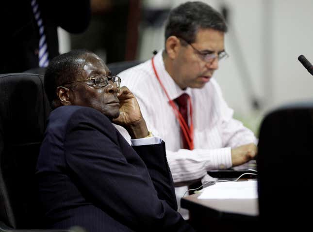 Zimbabwe's President Robert Mugabe sleeps during the second day of the Africa and South America Summit in Porlamar, capital of Margarita Island, Venezuela, Sunday, Sept. 27, 2009.