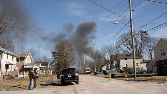 Smoke rises from a derailed cargo train in East Palestine, Ohio, on February 4, 2023.