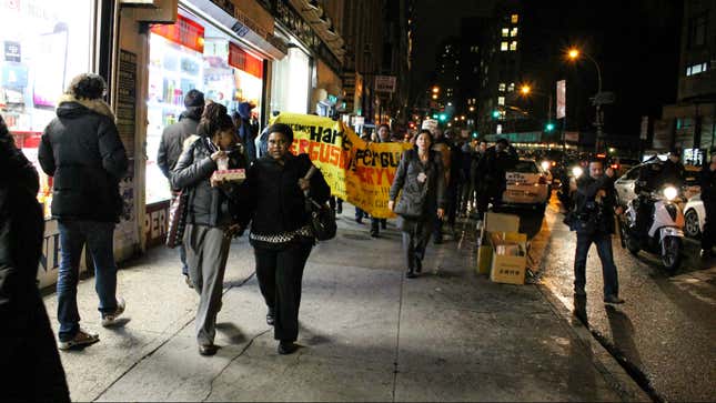 Protesters march along Broadway in Midtown Manhattan.