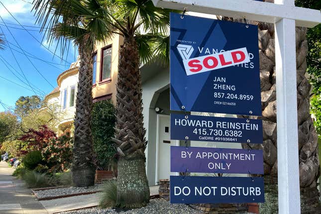 A notice indicating that a home has been sold appears on a sign in residential section of San Francisco, Friday, April 21, 2023. (AP Photo/Jeff Chiu)