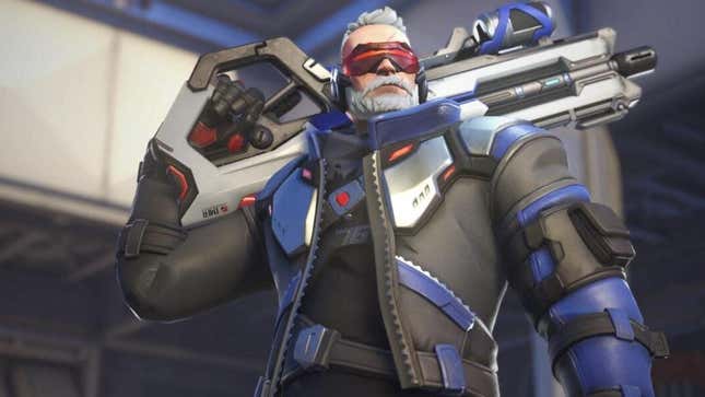 Soldier: 76 rests his gun on his shoulders.