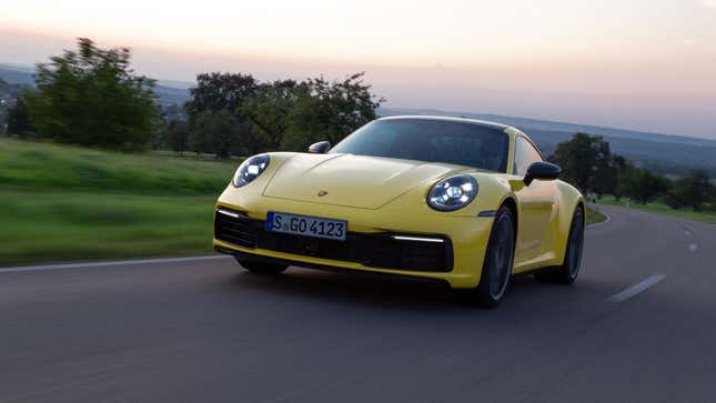 A photo of a yellow Porsche 911 sports car. 