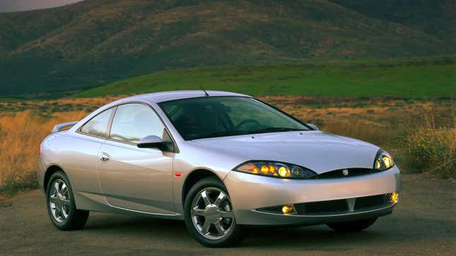 A silver Mercury Cougar coupe. 