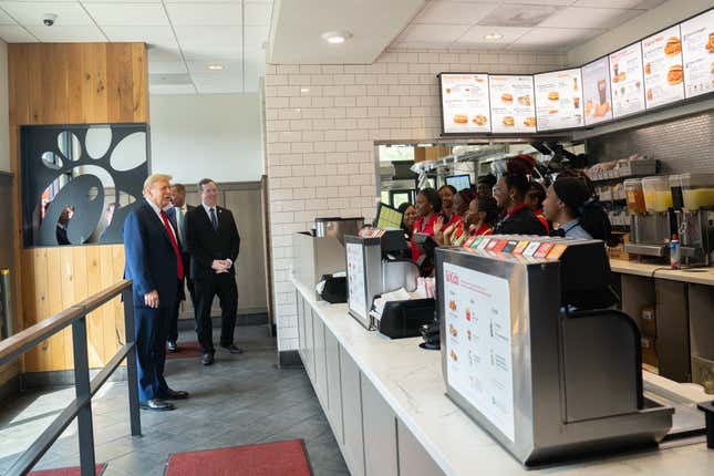 ATLANTA, GEORGIA - APRIL 10: Former U.S. President Donald Trump meets employees during a visit to a Chick-fil-A restaurant on April 10, 2024 in Atlanta, Georgia. Trump is visiting Atlanta for a campaign fundraising event he is hosting. (