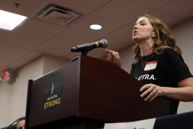 Actor Bethany Anne Lind speaks during a SAG-AFTRA rally in Atlanta on July 17, 2023. Lind has been a vocal proponent of the strike, which has had an especially large effect on Atlanta, one of the nation&#39;s filming hubs. (AP Photo/R.J. Rico)