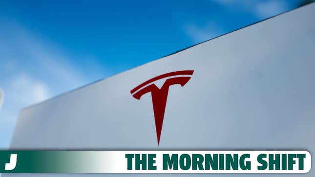 A photo of the Tesla logo on the side of a building with The Morning Shift banner below. 