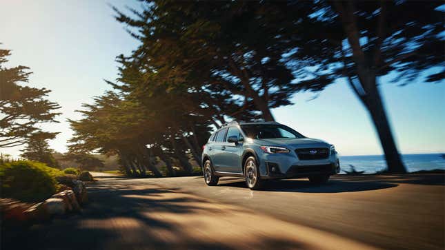 A photo of a blue Subaru Crosstrek station wagon. 