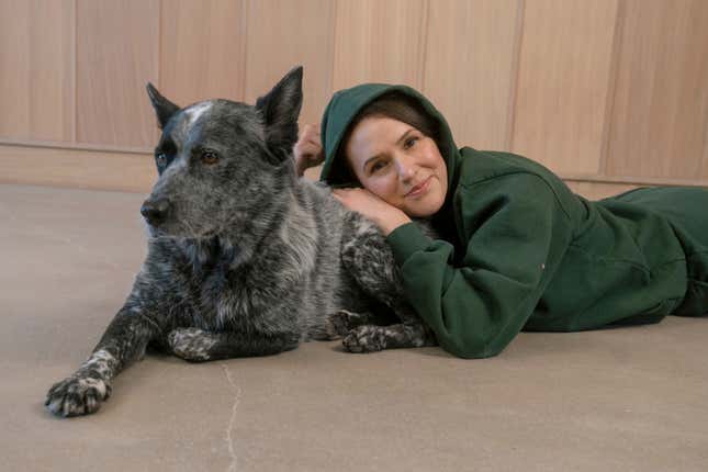 Adriene Mishler poses with her dog, Benji, in Austin, Texas on Nov. 29, 2022. Mishler received Benji as a gift as a puppy from her then-boyfriend soon after losing a beloved dog. Gifting pets, especially for the holidays, can be tricky. Animal welfare advocates suggest steering clear of the surprise gift element. (Find What Feels Good via AP)