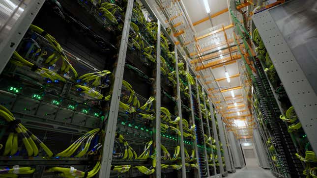 business new tamfitronics view of a walkway between racks and cables in a data center