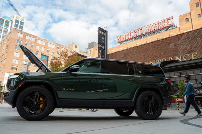 A Rivian R1S is displayed outside of the auto manufacturer&#39;s new space at Ponce City Market on Thursday, Oct. 19, 2023 in Atlanta. Rivian Automotive will move ahead with construction on a factory in Georgia early next year, the company confirmed Thursday. (Matthew Pearson/WABE via AP)