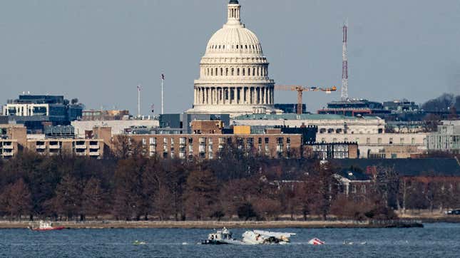 Emergency response units work at the crash site of the American Airlines plane on the Potomac River after the plane crashed last night on approach to Reagan National Airport on January 30, 2025 in Arlington, Virginia.