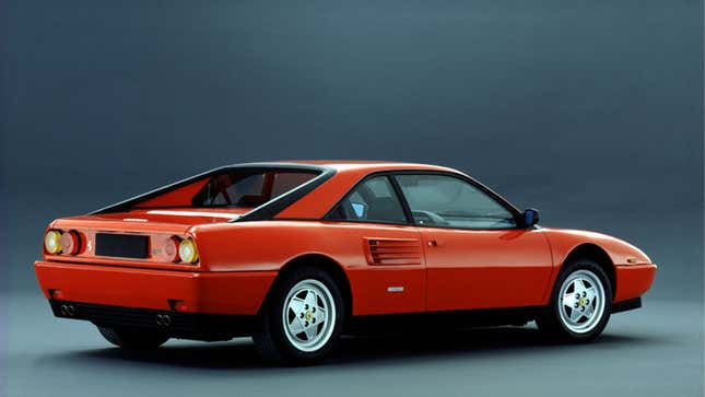 A photo of the rear quarter of a red Ferrari Mondial T. 