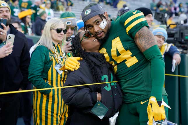 GREEN BAY, WISCONSIN - NOVEMBER 19: Jonathan Owens #34 of the Green Bay Packers meets with wife Simone Biles before the game against the Los Angeles Chargers at Lambeau Field on November 19, 2023 in Green Bay, Wisconsin.