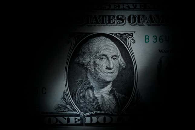 FILE - The likeness of George Washington is seen on a U.S. one dollar bill, March 13, 2023, in Marple Township, Pa. The Congressional Budget Office said Friday, Dec. 15, that it expects inflation to nearly hit the Federal Reserve&#39;s 2% target rate in 2024, as overall growth is expected to slow and unemployment is expected to rise into 2025, according to updated economic projections for the next two years. (AP Photo/Matt Slocum, File)