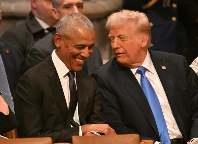 Former US President Barack Obama speaks with President-elect Donald Trump before the State Funeral Service for former US President Jimmy Carter at the Washington National Cathedral in Washington, DC, on January 9, 2025. 