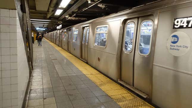 A World Trade Center-bound R160 E local train leaving on the Downtown local track of the 14th Street IND Eighth Avenue station, under 8th Avenue and 14th Street in Chelsea / West Village, Manhattan.