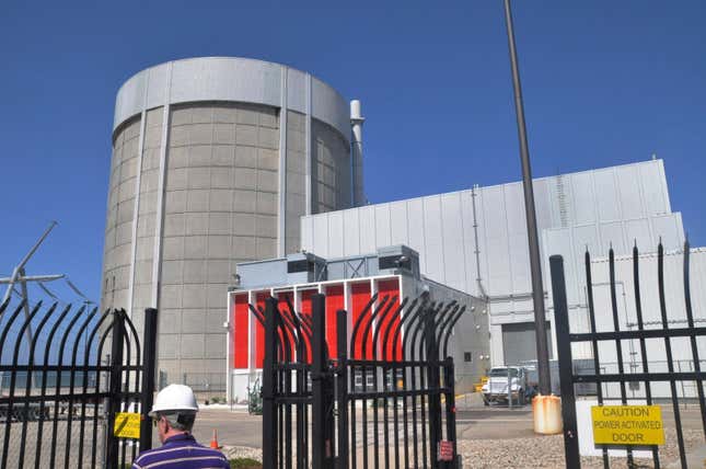 FILE- The Palisades Nuclear Generating Station in Covert, Mich., is pictured on June 24, 2010. The federal government will provide a $1.5 billion loan to restart a nuclear power plant in southwestern Michigan, officials announced Wednesday, March 27, 2024. Holtec International acquired the 800-megawatt Palisades plant in 2022 with plans to dismantle it. But now the emphasis is on restarting it by late 2025, following support from the state of Michigan and the Biden administration. (John Madill/The Herald-Palladium via AP, File)