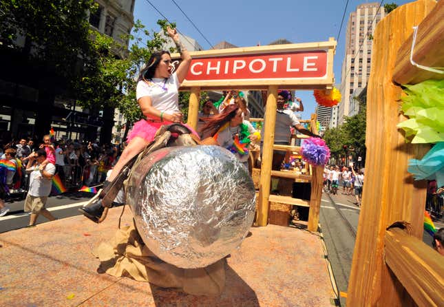 A woman rides a mechanical burrito on a Chipotle-themed float during San Francisco’s Gay Pride parade in California. 
