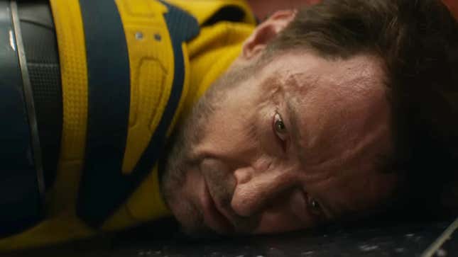 Wolverine with his face on the ground, looking kind of dead
