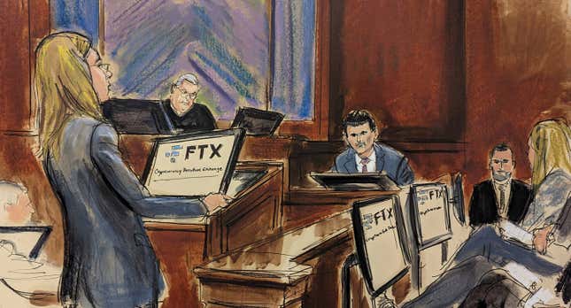 In this courtroom sketch, FTX founder Sam Bankman-Fried, background center, is cross examined by U.S. Assistant Attorney Danielle Sassoon, left, while Judge Lewis Kaplan listens, background second left, in Manhattan federal court, Monday, Oct. 30, 2023, in New York. Members of the jury are seated at right. (Elizabeth Williams via AP)