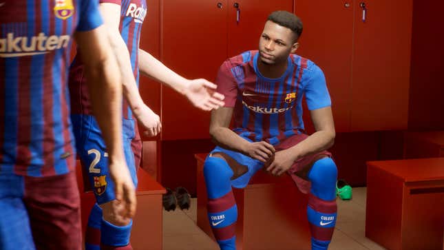 A soccer player stares sadly at his teammates.