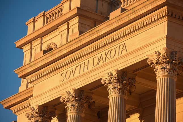 FILE - Sun shines on South Dakota Capitol, Jan. 12, 2021, in Pierre, S.D. South Dakota officials will no longer deny applications for personalized license plates based on a state law that says any plate can be denied if it’s found to be “offensive to good taste and decency.” Officials agreed to the change as part of a settlement approved by a judge on Friday. As part of the settlement, state officials acknowledged that the “good taste and decency” language is unconstitutional. (Erin Bormett/The Argus Leader via AP, File)