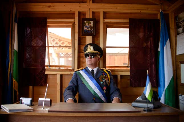 President Baugh of Molossia sits in the Office of the President — which he built.