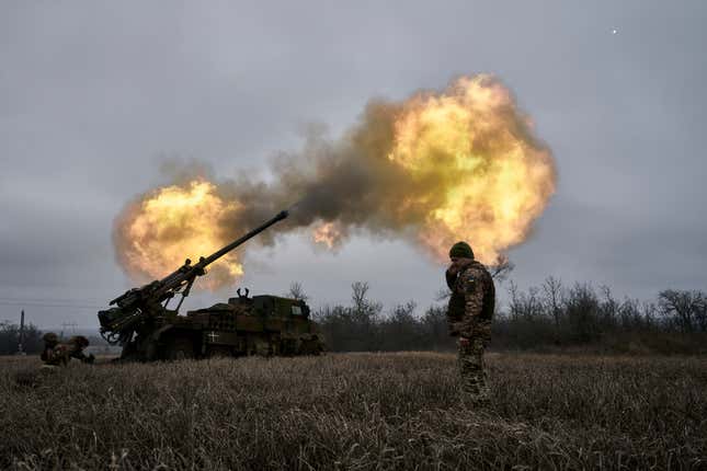 FILE - Ukrainian soldiers fire a French-made CAESAR self-propelled howitzer towards Russian positions near Avdiivka, Donetsk region, Ukraine, Monday, Dec. 26, 2022. French manufacturers have halved or better the manufacturing times for some of the weapons systems they are supplying to Ukraine, as France increasingly switches away from its previous policy of dipping into its own military stocks to furnish the war effort against Russia, the French defense minister said in an interview published Thursday Jan.18, 2024. . (AP Photo/Libkos, FILE)