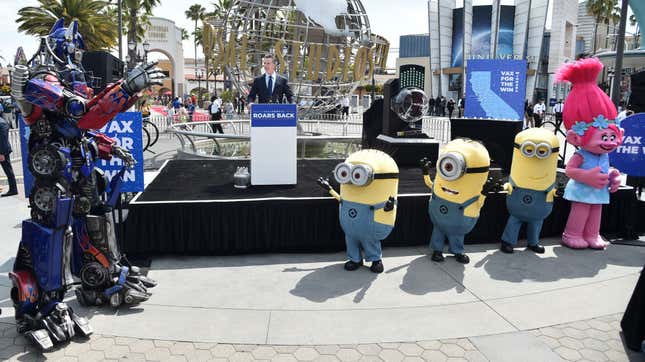 Optimus Prime, California Governor Gavin Newsom, some minions, and a troll attend a press conference about re-opening the state of California in June 2021 outside of Universal Studios Hollywood.