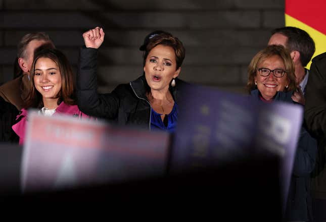 PRESCOTT, AZ - NOVEMBER 07: Arizona Republican gubernatorial candidate Kari Lake (C) pumps her fist during a get-out-the-vote campaign rally on November 07, 2022, in Prescott, Arizona. With one day to go until election day, Kari Lake and other Republican candidates are campaigning throughout the state ahead of Tuesday’s midterm election.