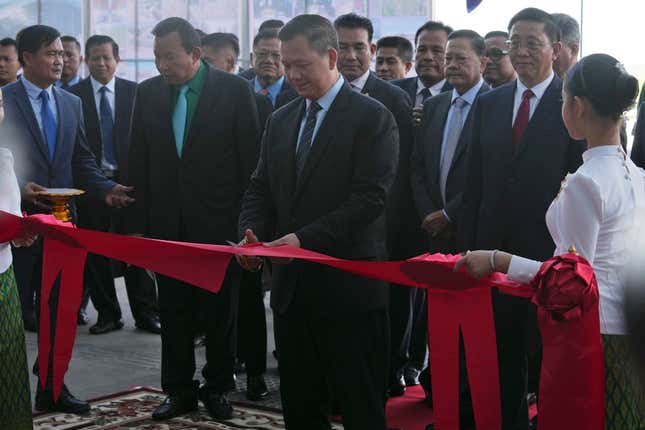 Cambodian Prime Minister Hun Manet, center, cuts the ribbon to inaugurate the Siem Reap-Angkor International Airport, in Cambodia, Thursday, Nov. 16, 2023. Cambodia on Thursday officially inaugurated the country&#39;s newest and biggest airport, a Chinese-financed project meant to serve as an upgraded gateway to the country’s major tourist attraction, the centuries-old Angkor Wat temple complex in the northwestern province of Siem Reap. (AP Photo/Heng Sinith)