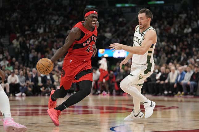 Nov 1, 2023; Toronto, Ontario, CAN; Toronto Raptors forward Pascal Siakam (43) drives to the net past Milwaukee Bucks guard Pat Connaughton (24) during the first half at Scotiabank Arena.