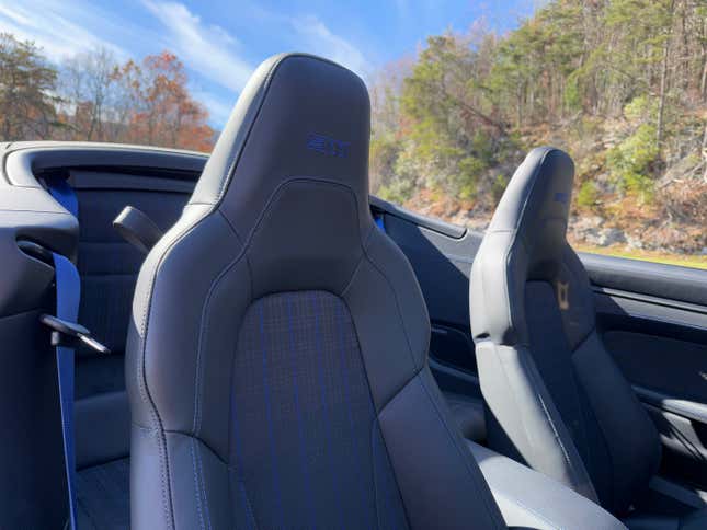 Front seats of a blue 2025 Porsche 911 Carrera T cabriolet