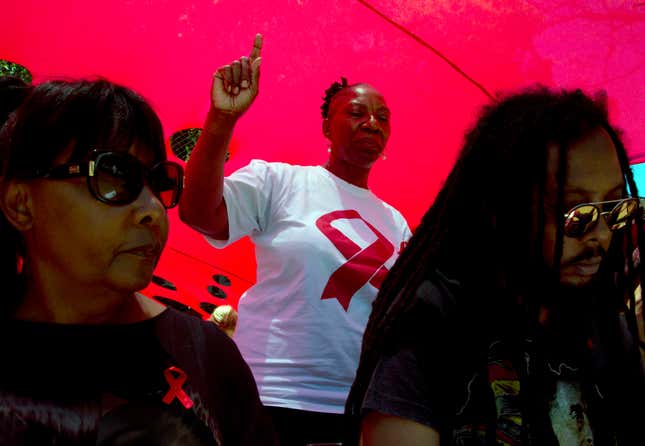 FILE - A woman dances as she listens to music while attending a World AIDS Day commemoration at Nkosi&#39;s Haven in Johannesburg on Nov. 30, 2019 on the eve of World AIDS Day. AIDS experts said Wednesday Nov. 29, 2023 that an African-based company will start producing vaginal rings that protect against HIV within the next few years, potentially offering millions of women across the continent a cheap way to reduce their risk. (AP Photo/Denis Farrell, File)