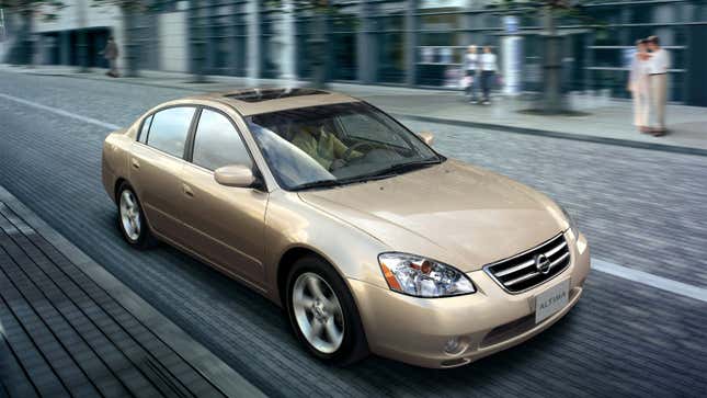 A photo of a gold Nissan Altima sedan. 