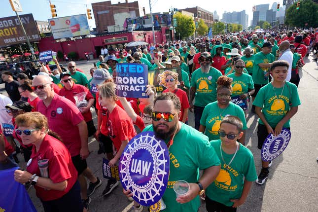 File - United Auto Workers members walk in the Labor Day parade in Detroit on Sept. 4, 2023. The union is threatening to strike any automaker that hasn&#39;t reached an agreement by the time contracts expire on Sept. 14. (AP Photo/Paul Sancya, File)