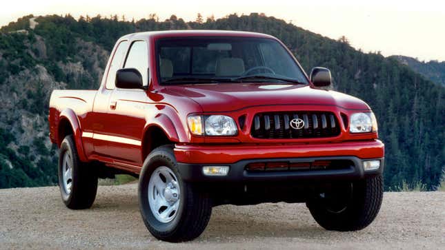 A photo of a red Toyota Tacoma pickup truck. 