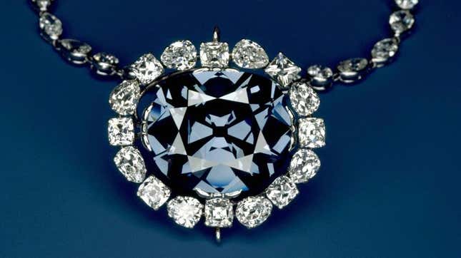 The Hope Diamond in a pendant of white diamonds.