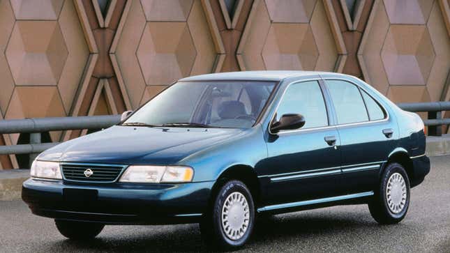 A teal Nissan Senatra sedan. 