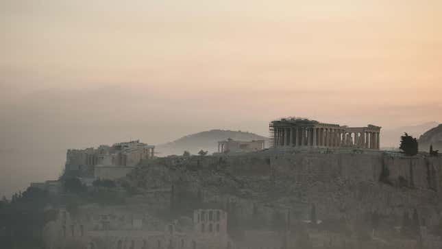 Smoke covers Athens Centre and the Acropolis as fires burn at the foot of Mount Parnitha, a national park north of Athens, Greece.
