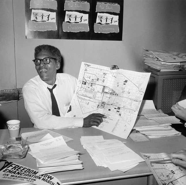 Aug. 24, 1963 - Bayard Rustin points to a map showing the path of the March on Washington during a news conference at the New York City headquarters. 