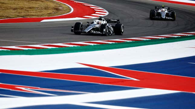 A photo of two AlphaTauri F1 cars racing in Austin. 