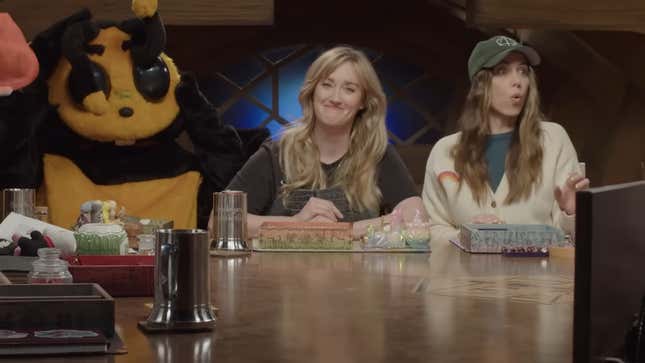 A screenshot of the Beacon announcement video, featuring Sam Reigel in a bee outfit, Ashley Johnson, and Laura Bailey.